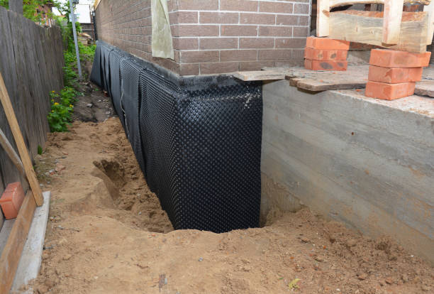 SJ Waterproofing Pros technician performing targeted Exterior Waterproofing assessment in Millbury, OH